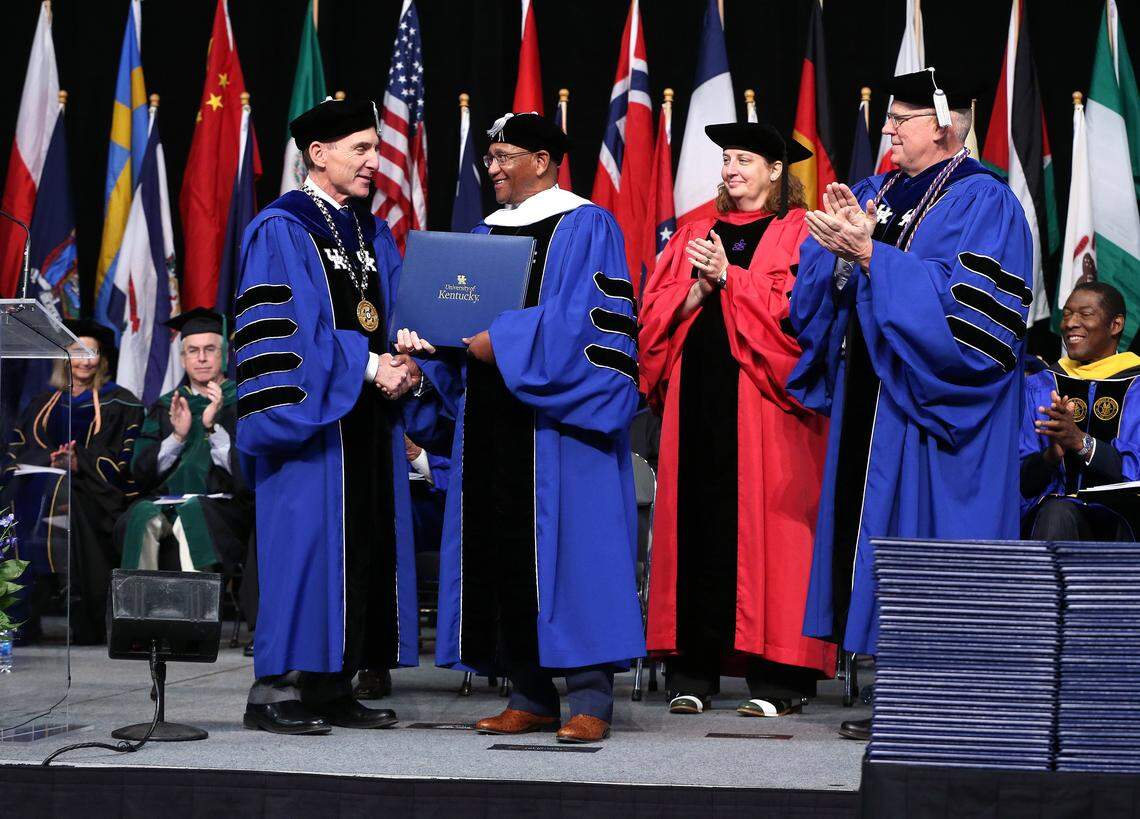 Dr. Eli Capilouto awarded Dr. Porter G. Peeples an honorary doctor of humane letters degree Friday morning during University of Kentucky commencement exercises at Rupp Arena Friday, Dec. 20, 2019.