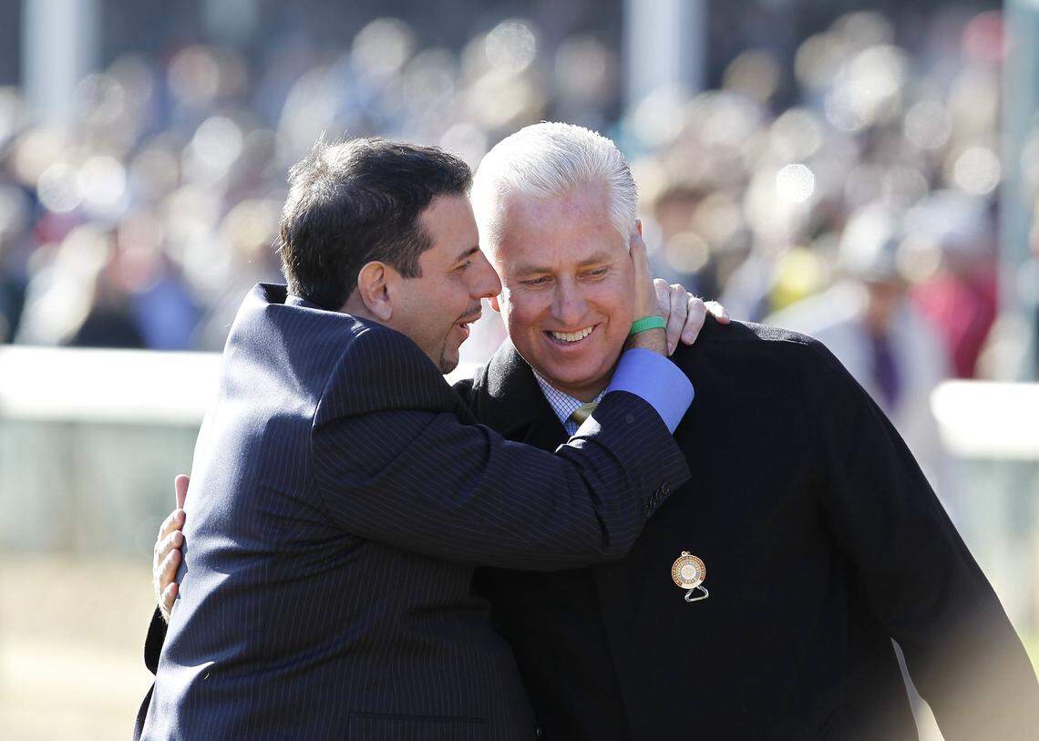 Owner Mike Repole, left, and trainer Todd Pletcher celebrate after winning the 2010 Breeders’ Cup Juvenile at Churchill Downs in Louisville with Uncle Mo.
