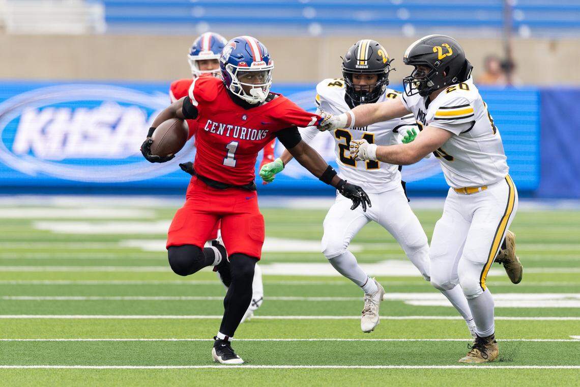 Christian Academy-Louisville's Jahyde Brown (1) gets tackled by defender during the Class 3A UK Healthcare Sports Medicine State Football Finals Saturday, December 6th, 2025 at Kroger Field in Lexington KY