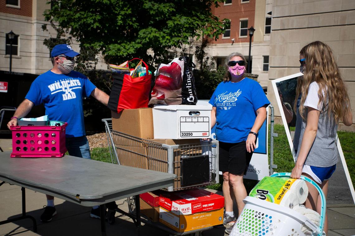 Business Management freshman Leinda McNabb, right, moves into her dorm on the University of Kentucky campus with the help of her parents Larry and Renee, in Lexington, Ky., on Saturday, August 8, 2020. UK had about 1000 of their total 6500 students living in dorms move in on Saturday with social distancing and other safety measures in place because of the COVID-19 pandemic.