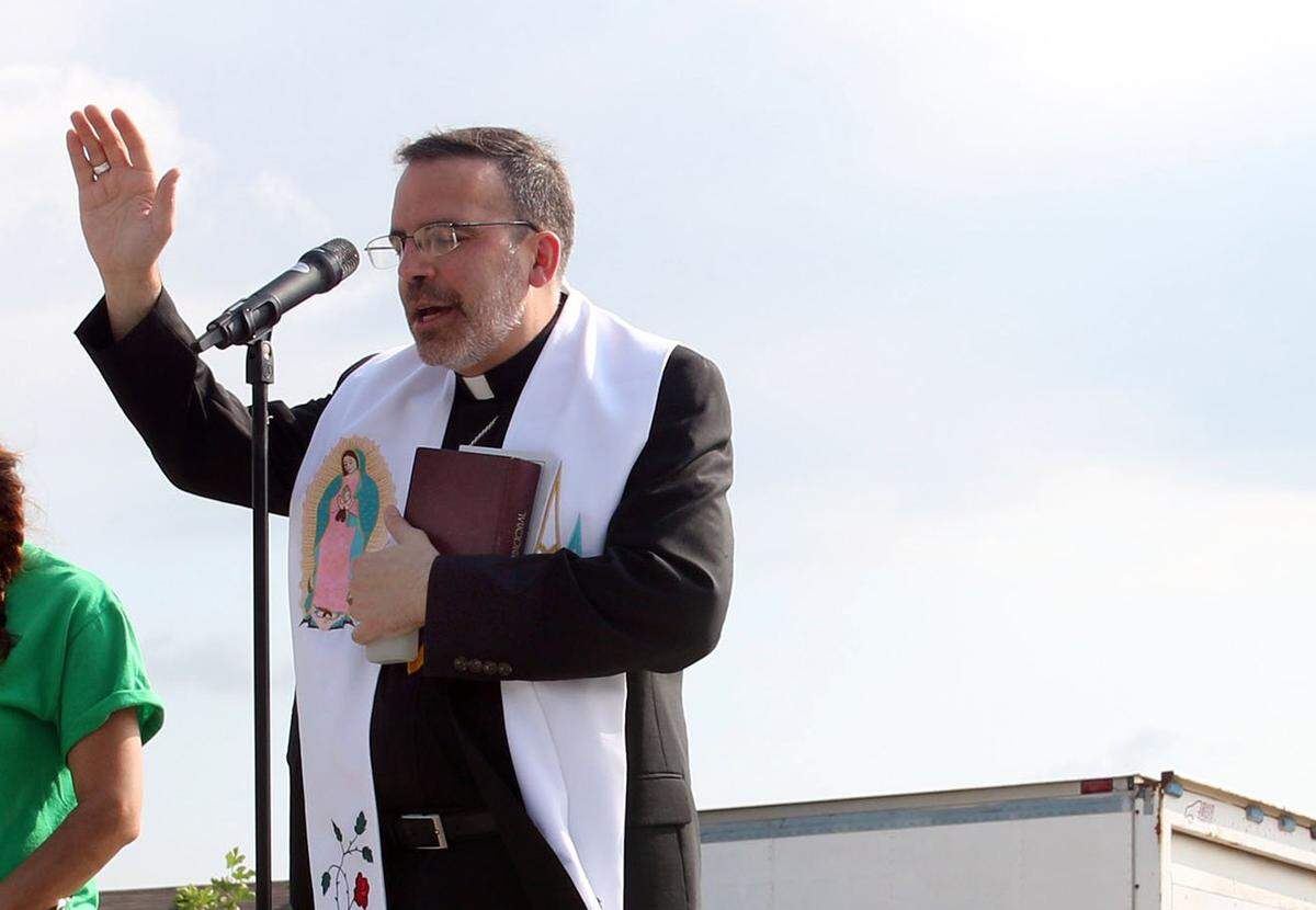Bishop John Stowe spoke at the blessing of a new Habitat for Humanity home in Lexington in 2015.