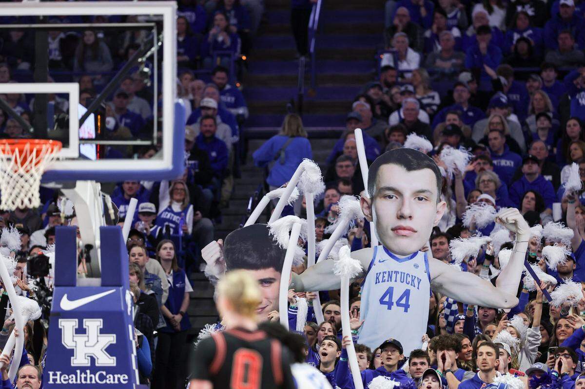 A sign for Kentucky forward Zvonimir Ivisic (44) is held up in the student section during Saturday’s game against Georgia at Rupp Arena.