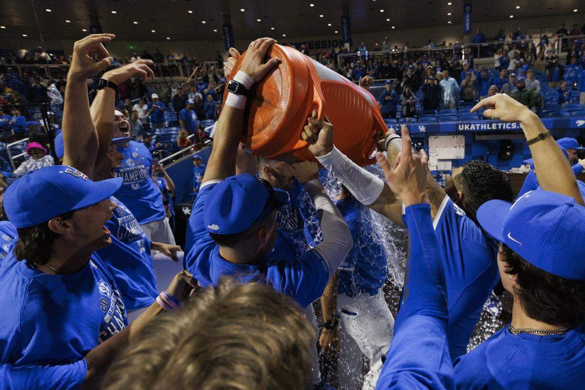 Kentucky’s baseball team celebrates clinching a share of the SEC championship after its win against Vanderbilt on Friday.