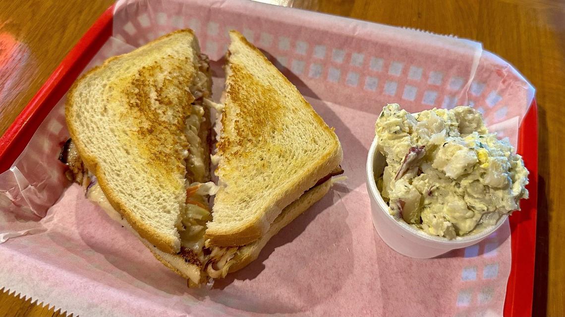 An Ole’ Smokey sandwich with potato salad from Double H BBQ. The sandwich comes with hot grilled turkey, melted Swiss cheese, cole slaw, Alabama white sauce on toasted bread for $11.27.