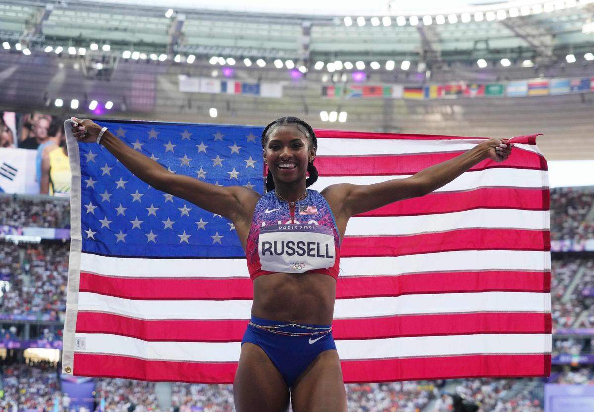 Aug 10, 2024; Saint-Denis, FRANCE;  Masai Russell (USA) celebrates winning the women's 100m hurdles final during the Paris 2024 Olympic Summer Games at Stade de France. Mandatory Credit: Kirby Lee-USA TODAY Sports