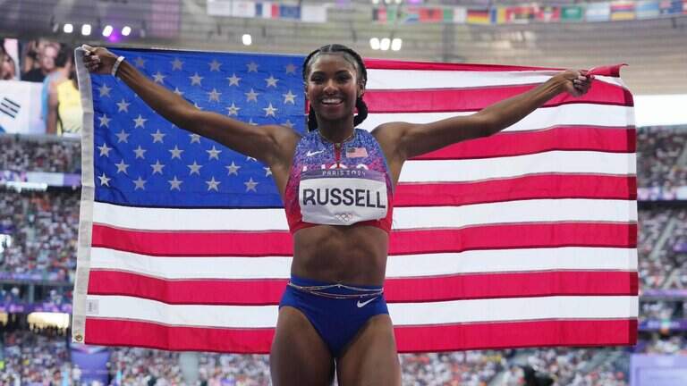 Former Kentucky hurdles star Masai Russell wins gold medal in her Olympic debut