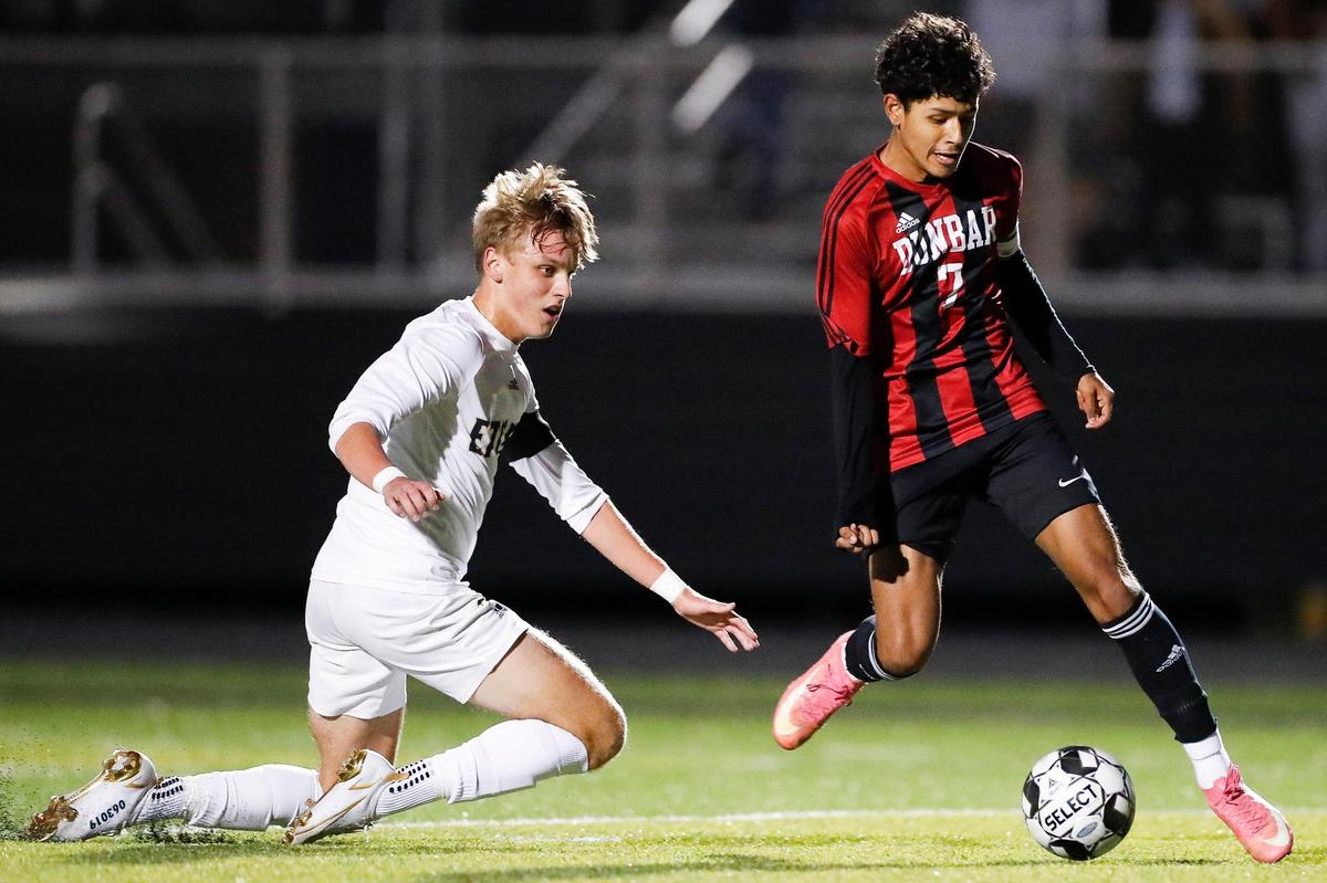 Issac Cano (7) scored past Elizabethtown’s Landin Grzelewski (15) during the KHSAA boys’ soccer state tournament semifinals in Lexington in 2021. Cano helped lead Paul Laurence Dunbar to the 2021 state championship.
