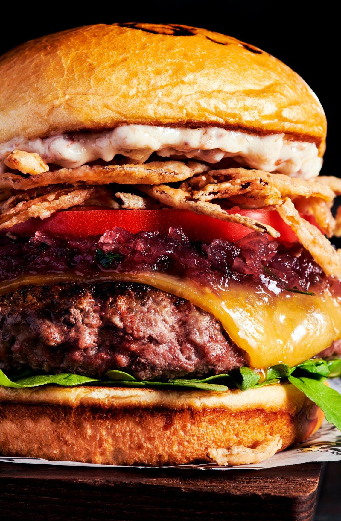 The Estate Burger ($16.99) at Ford’s Garage comes with smoked gouda cheese, sweet red onion marmalade, arugula, tomato, fried onion straws and white truffle bacon aioli on a brioche bun.