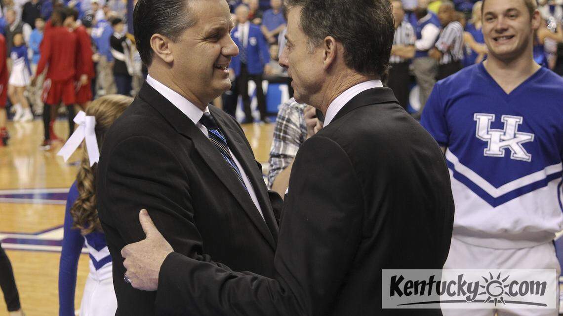 Kentucky Coach John Calipari, left, and Louisville Coach Rick Pitino, shown before the teams played in Lexington on Dec. 28, having differing viewpoints about athletes and social media.