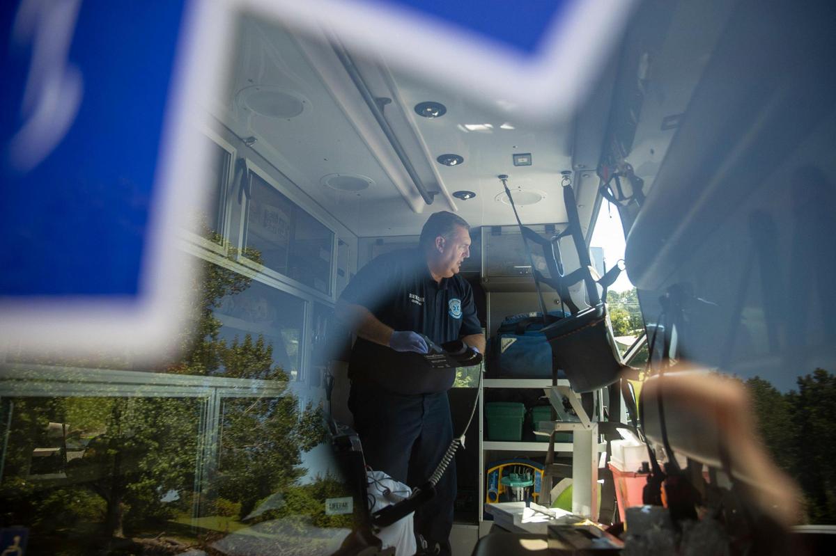 Dwayne Oliver, a Lee County EMT, prepares an ambulance for the next run after responding to a call in Beattyville, Ky., on Tuesday, Sept. 7, 2021.