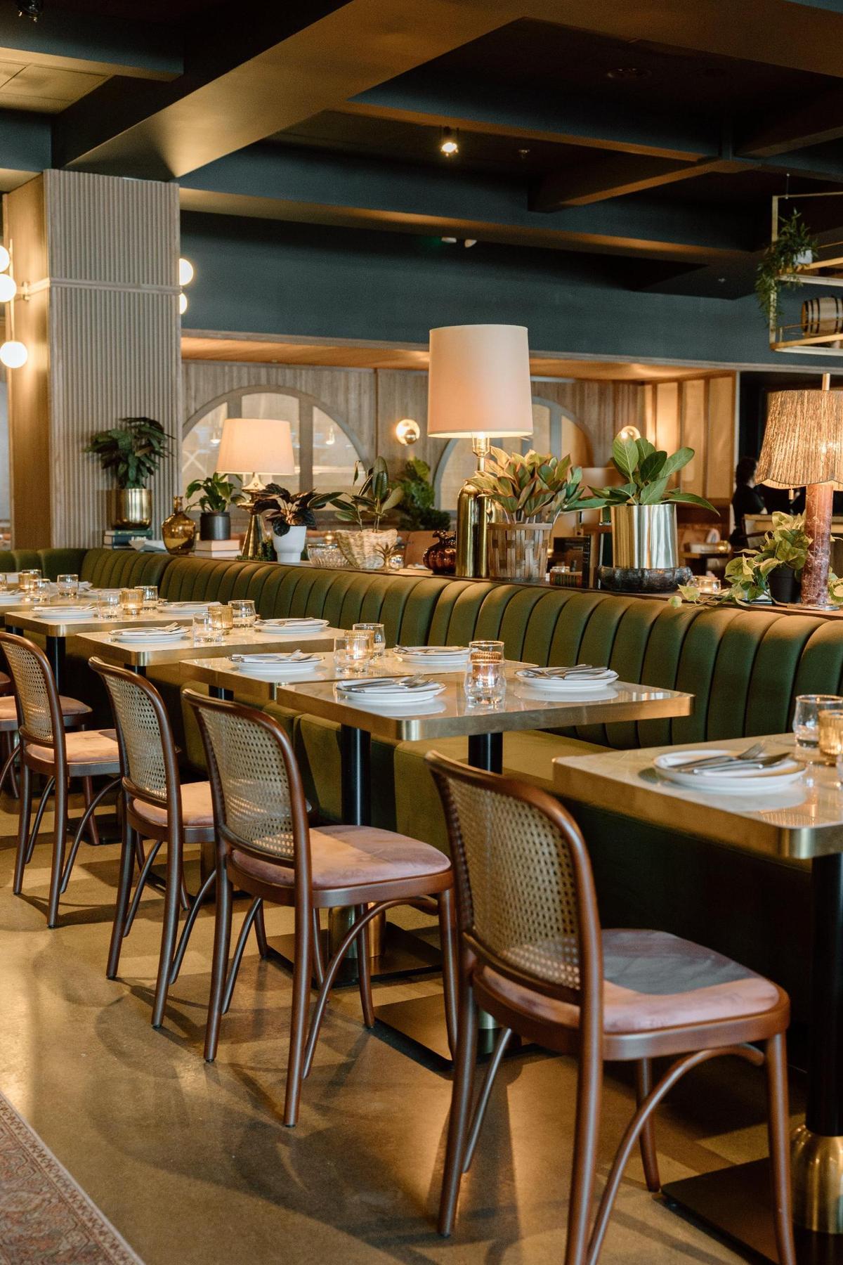 The main dining room of Mileta at Fayette Mall features a mid-century modern look with bohemian influences including notes of Keeneland with rich greens and brass. The owners say since they opened at the end of 2024 they’ve been consistently busy and they expected it to tail off in the summer, but that hasn’t been the case.