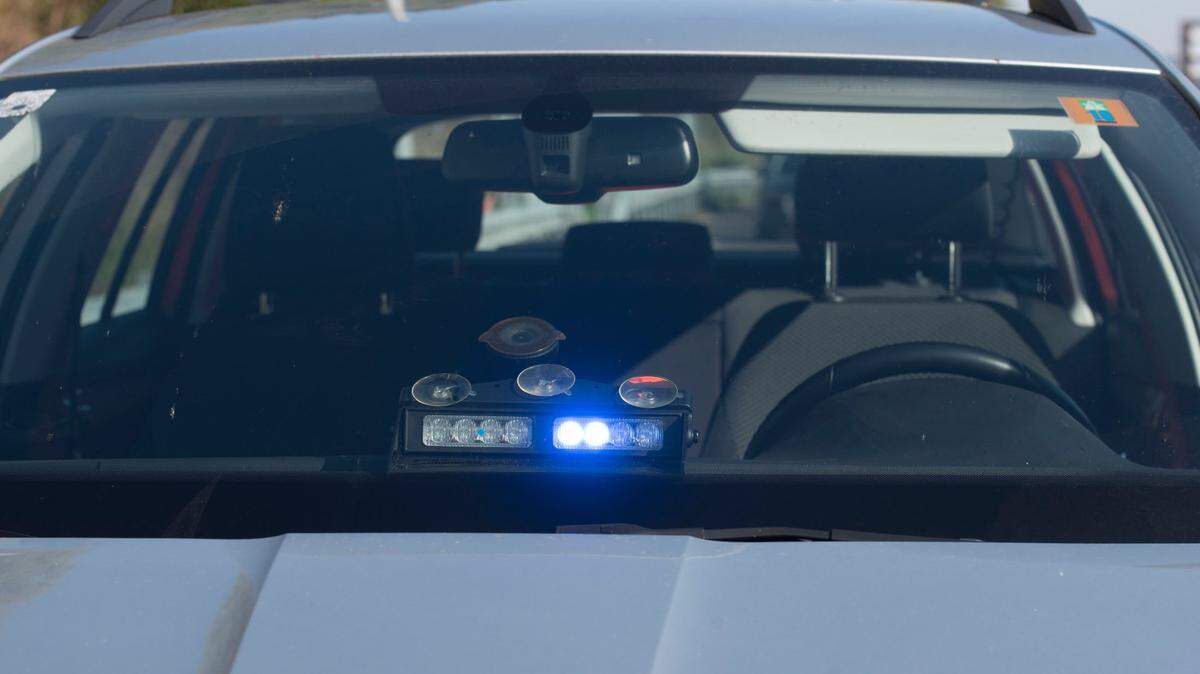 An unmarked police car displays a blue light in this stock image from Getty Images.