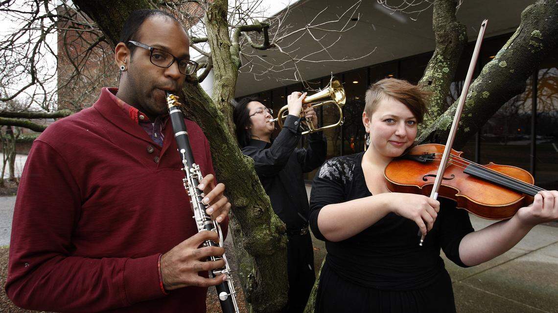 Rui Li, center, on flugelhorn was competition winner. The duo of Chase Miller, left, on clarinet, and Leigh Dixon on viola were also honored.