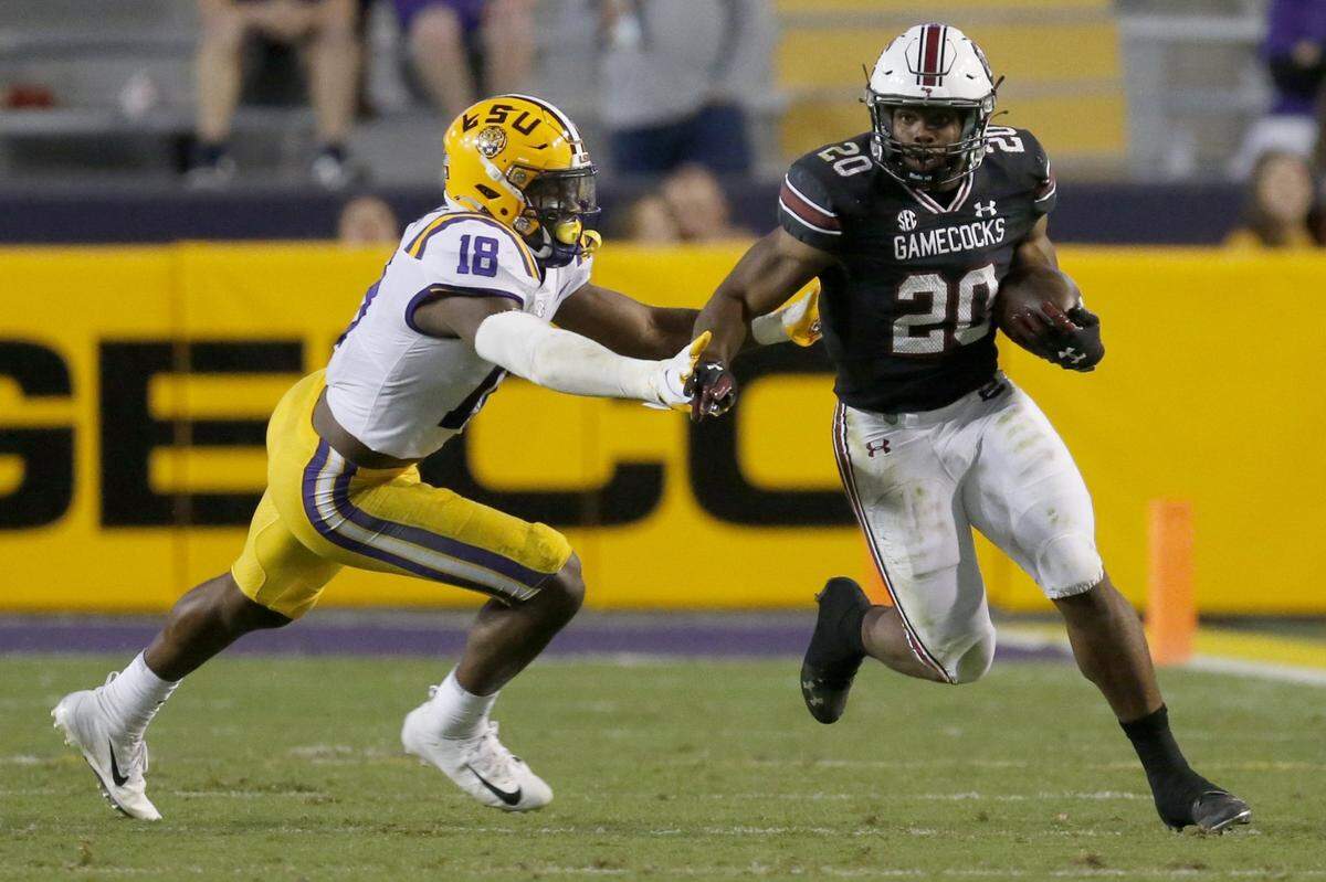 The SEC’s leading rusher in 2020, South Carolina running back Kevin Harris (20) needs at least 73 rushing yards Saturday against Kentucky to go over 1,000 for the season.