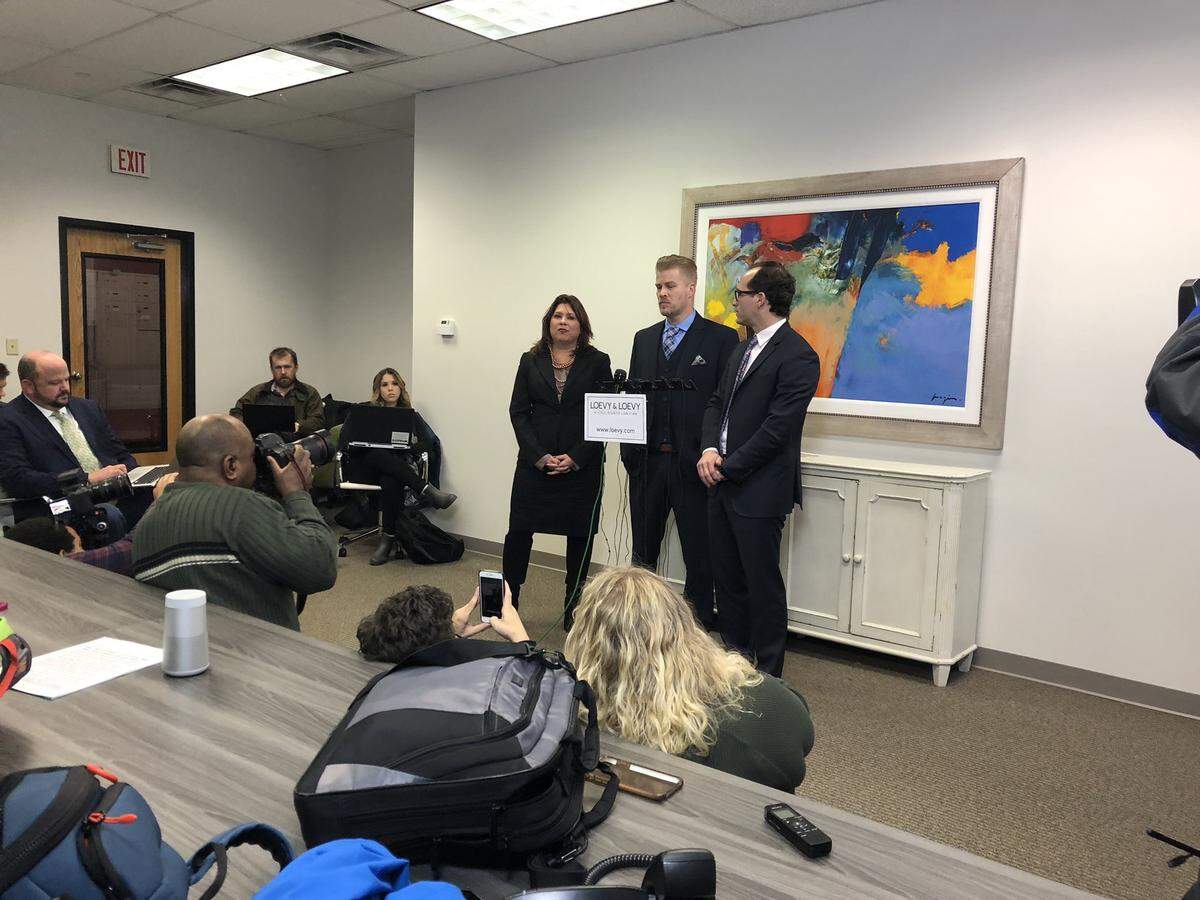 Patrick Baker, center, is flanked by attorneys Elliot Slosar, right, and Amy Robinson Staples during a news conference in Lexington, Ky., on Dec. 17, 2019, to proclaim his innocence and thank former Gov. Matt Bevin for pardoning Baker.