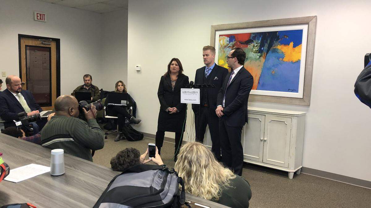Patrick Baker, center, is flanked by attorneys Elliot Slosar, right, and Amy Robinson Staples during a news conference in Lexington, Ky., on Dec. 17, 2019, to proclaim his innocence and thank former Gov. Matt Bevin for pardoning Baker.