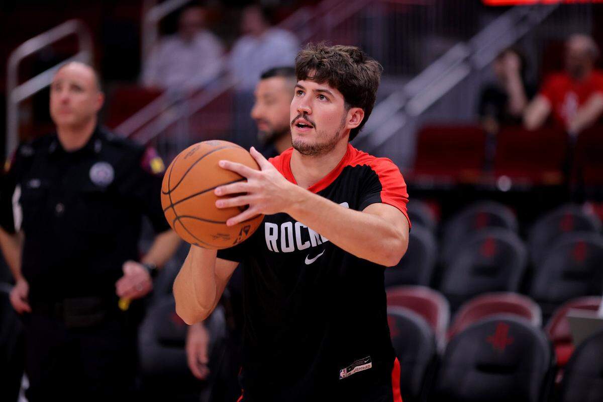 Oct 15, 2024; Houston, Texas, USA; Houston Rockets guard Reed Sheppard (15) warms up prior to the game against the New Orleans Pelicans at Toyota Center. Mandatory Credit: Erik Williams-Imagn Images
