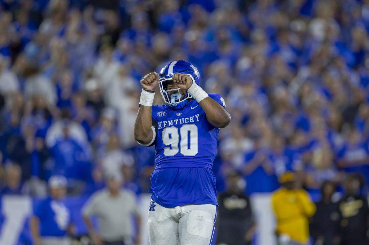 Kentucky defensive lineman Tre’vonn Rybka (90) reacts after the Wildcats held Southern Miss on third down during Saturday’s game at Kroger Field.
