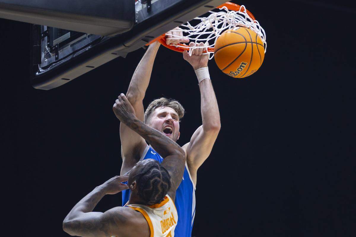 Kentucky forward Andrew Carr dunks against Tennessee forward Felix Okpara during Friday’s Sweet 16 game at Lucas Oil Stadium in Indianapolis. Prior to playing his fifth season at UK, Carr played college basketball at Delaware and Wake Forest.