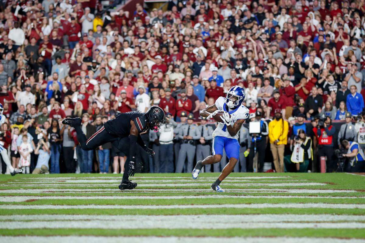 Kentucky Wildcats wide receiver Barion Brown (7) catches a pass for a touchdown against the South Carolina Gamecocks during the game at Rupp Arena in Lexington, Ky, Friday, November 17, 2023.