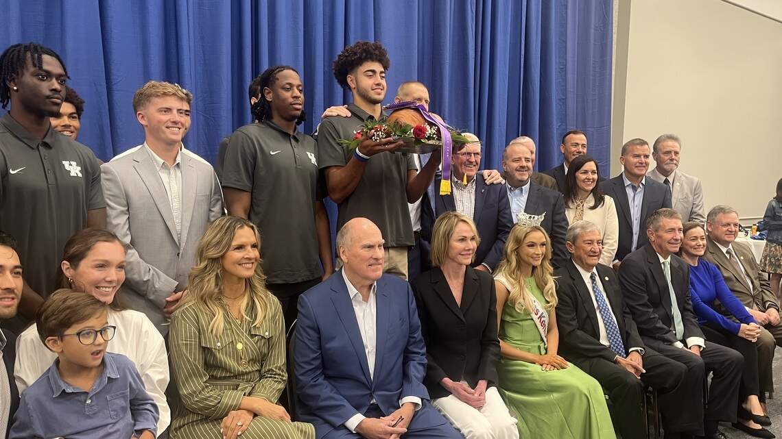 Kelly and Joe Craft help make the winning bid for KY’s famed ham once again
