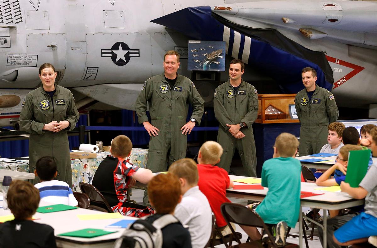 The crew of two US Navy F/A-18F Super Hornet fighter planes that landed at Blue Grass Airport talked to campers at The Aviation Museum of Kentucky’s Aviation Summer Camp. Left to right: Squad leader Stacy Uttech, Brad Williams, Luke Delisio and Elliott Shoup. The four members of the crew talked to the campers and gave them a tour of the fighter jets.