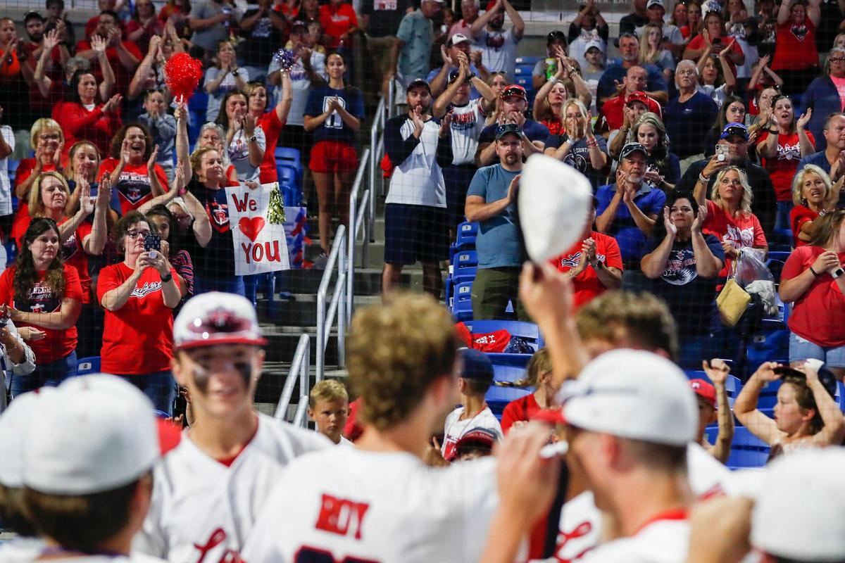 Russell County fans cheer on their team as they face St. Xavier in the state baseball championship game at Kentucky Proud Park.