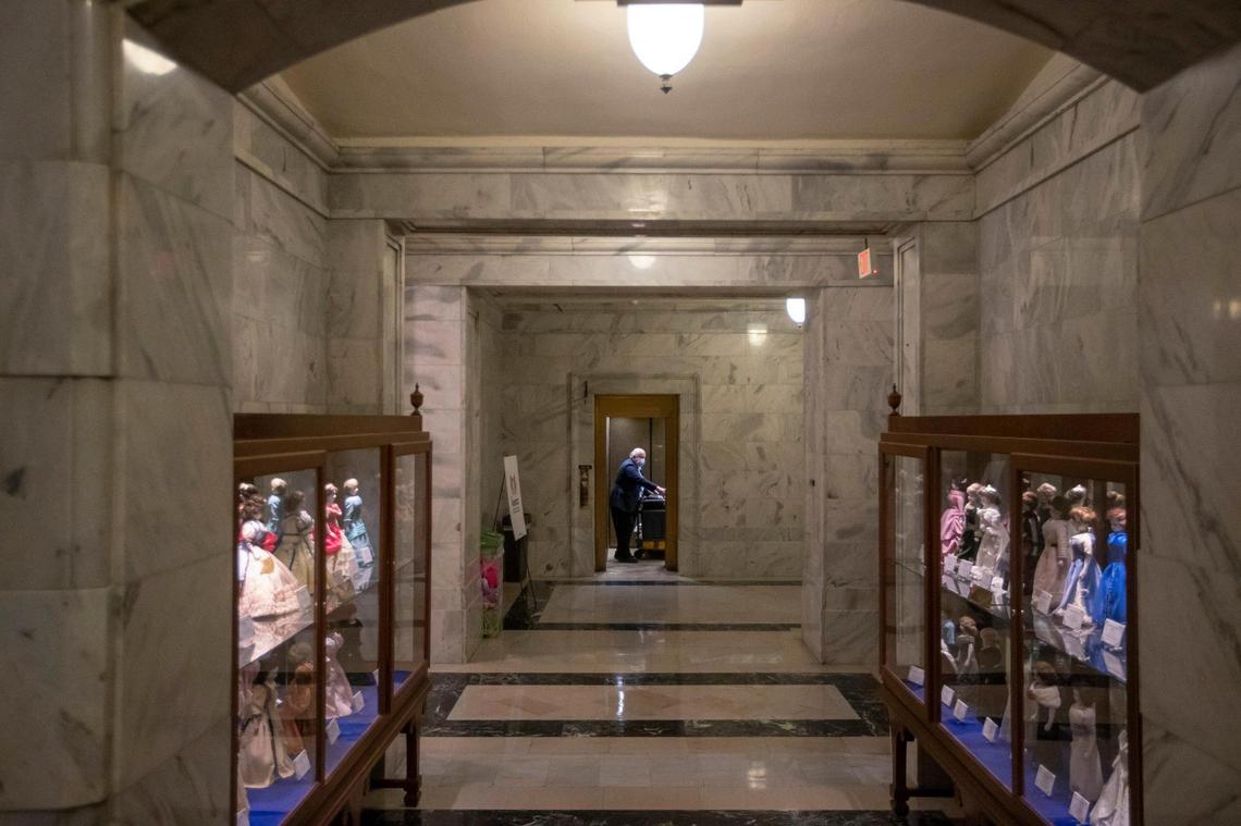Longtime Lexington Herald-Leader Capitol Bureau Chief Jack Brammer rides an elevator with his belongings on his last day at the Kentucky state Capitol in Frankfort, Ky., on Wednesday, Dec. 29, 2021.