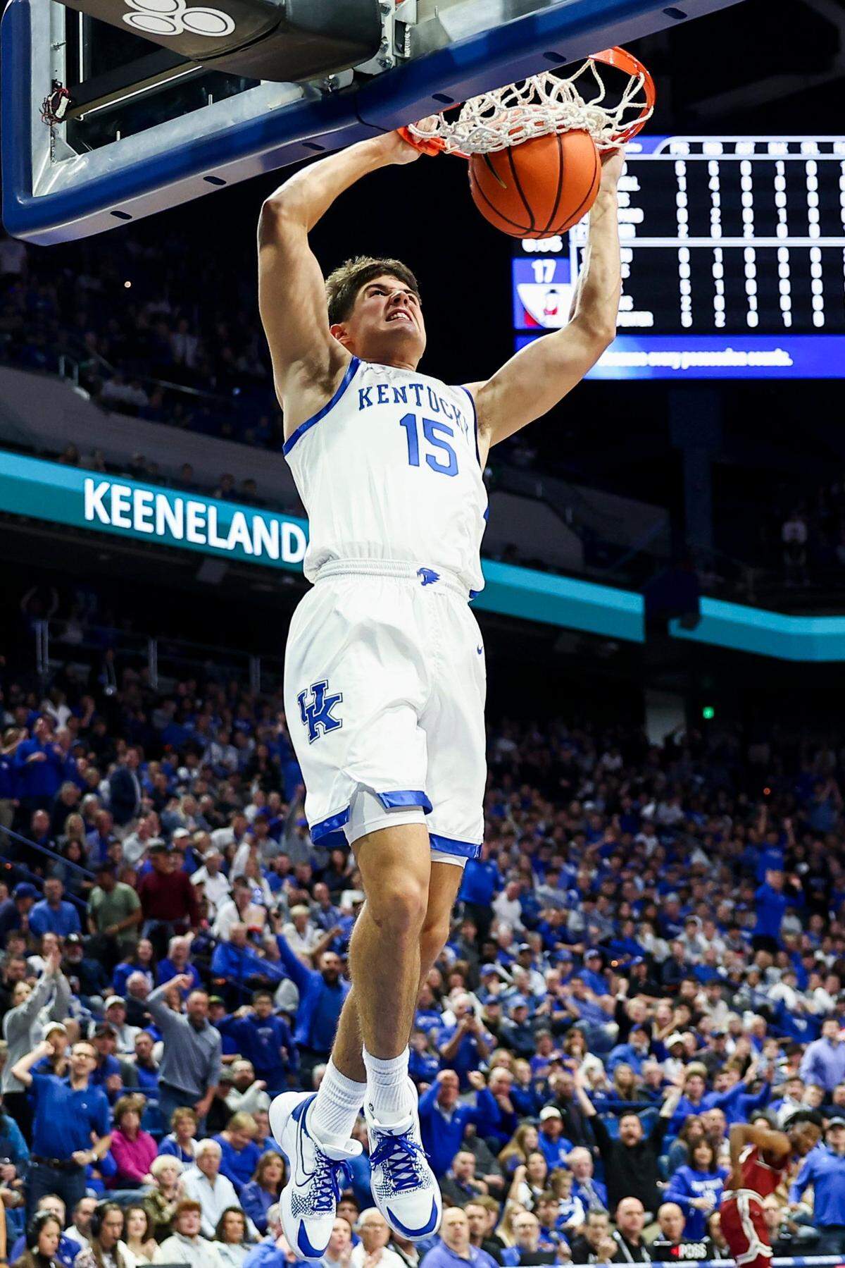 Kentucky guard Reed Sheppard (15) dunks the ball against New Mexico State for the first basket of his college career.