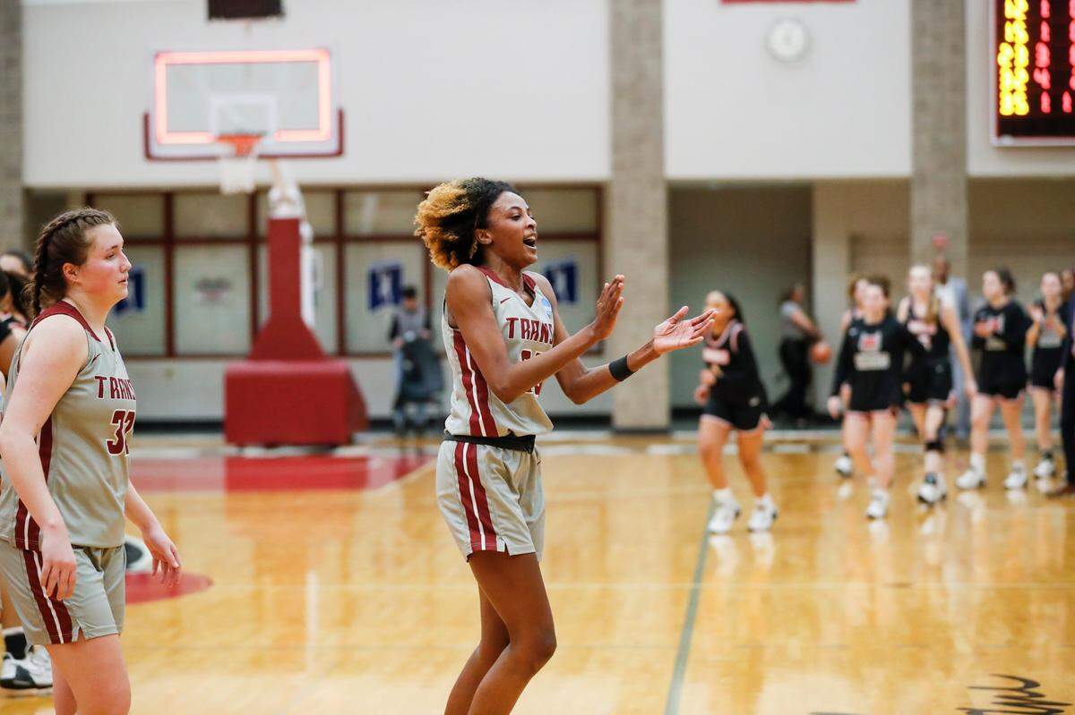 Transylvania’s Dasia Thornton (35) celebrates after the Pioneers’ first-round NCAA win over Rhodes College. Transy plays Saturday for the Division III national championship.