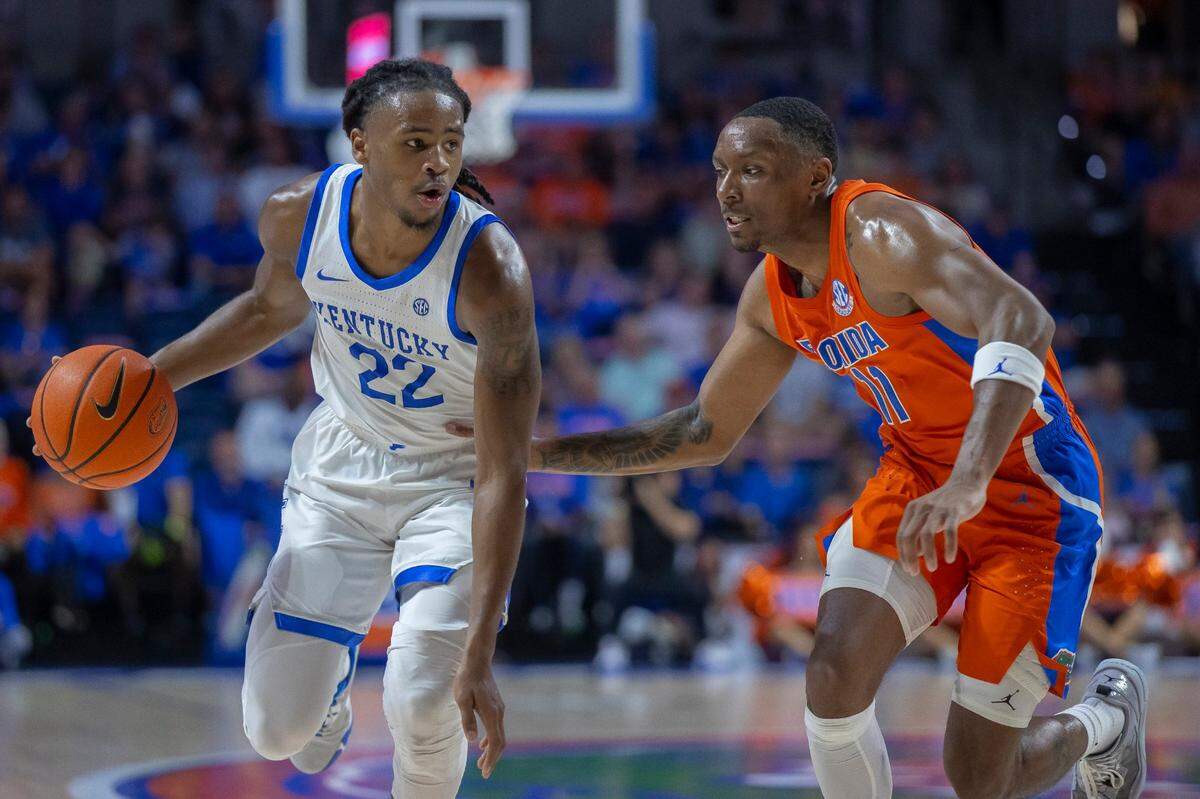 Kentucky’s Cason Wallace (22) brings the ball down the court against Florida’s Kyle Lofton (11) on Wednesday night. Wallace finished with eight points, two rebounds, six assists, two steals and six turnovers.