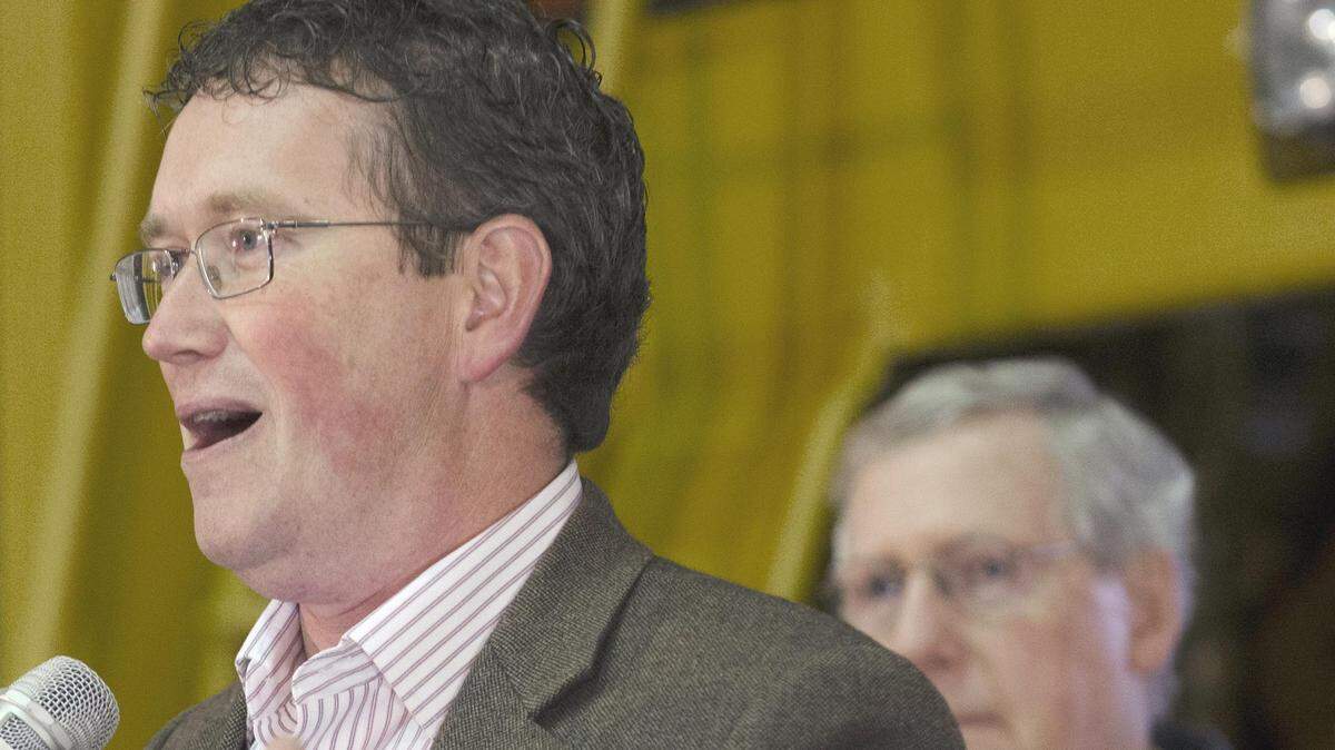 U.S. Rep. Thomas Massie of Vanceburg, a hero of the Tea Party, introduced Senate Minority Leader Mitch McConnell, background, on Wednesday during a campaign stop near Ashland.