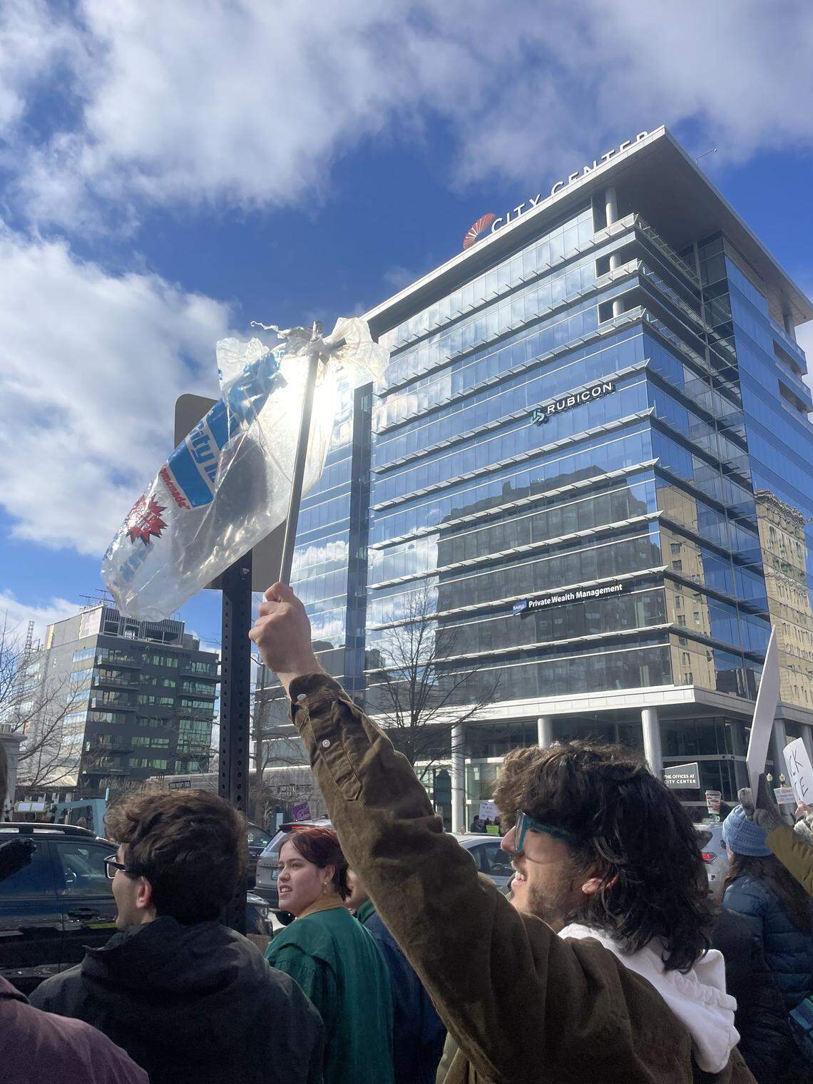 A protester holds an ICE bag on a stick outside City Center in Lexington at an ‘ICE Out For Good’ protest Jan. 11, 2026.