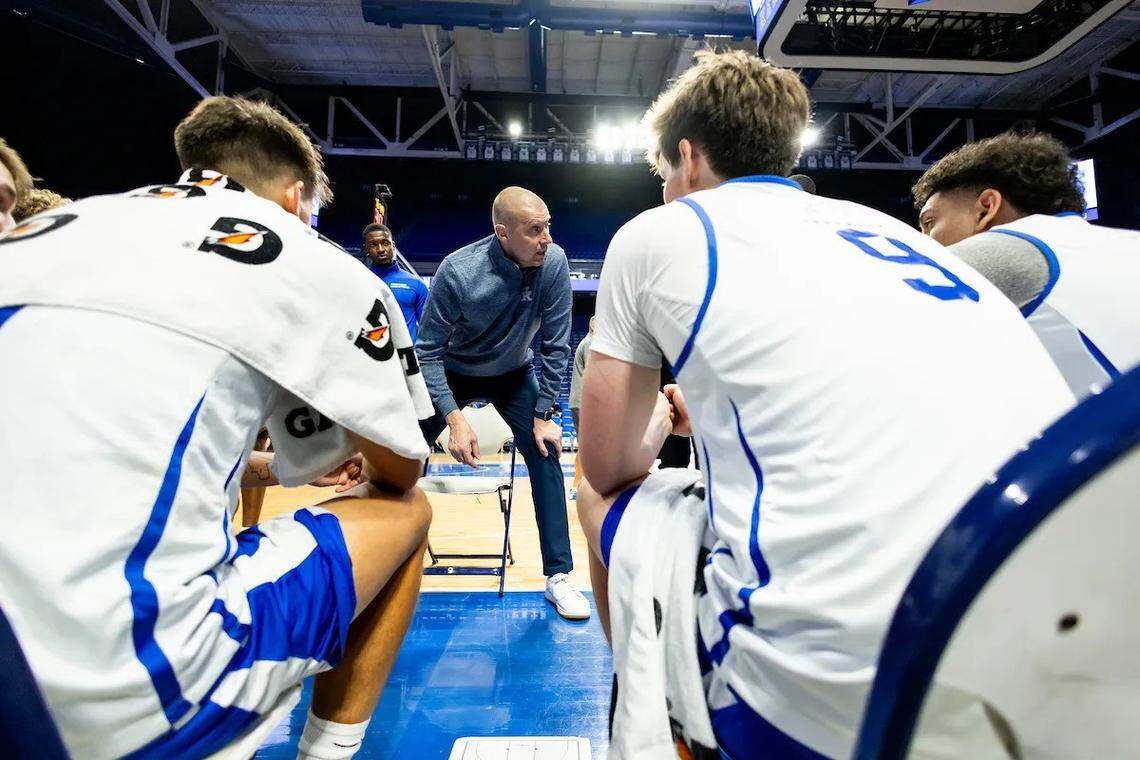 Kentucky players listen to head coach Mark Pope during a practice at Rupp Arena this summer.
