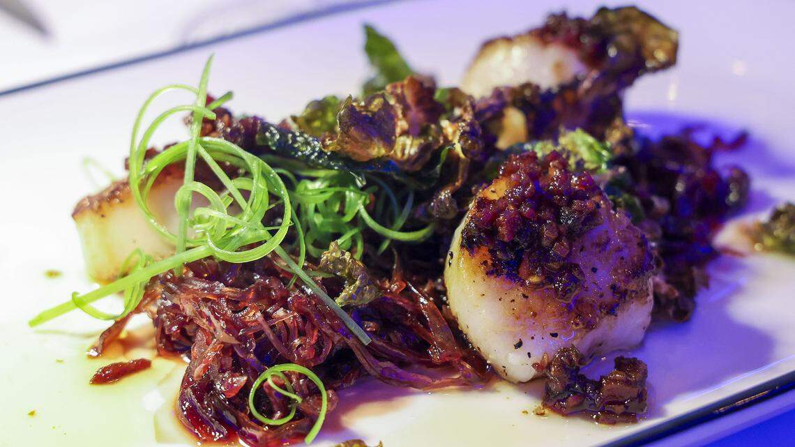 Hokkaido scallops with braised red cabbage, country ham XO, fried Brussels leaves and scallion threads ($61) from The V, the public restaurant at The Vine, a new downtown Lexington development, photographed Friday, Sept. 5, 2025.
