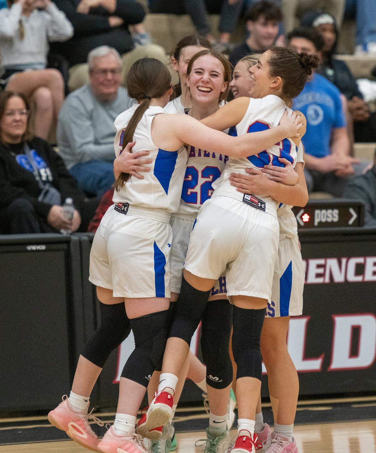Lafayette’s Anna Clay Denton (22) celebrates Friday’s 49-33 win over Lexington Christian Academy with teammates Kierstyn Kelley, left, Skylar Davis (33), Abbey Popham and Tess Nelson.