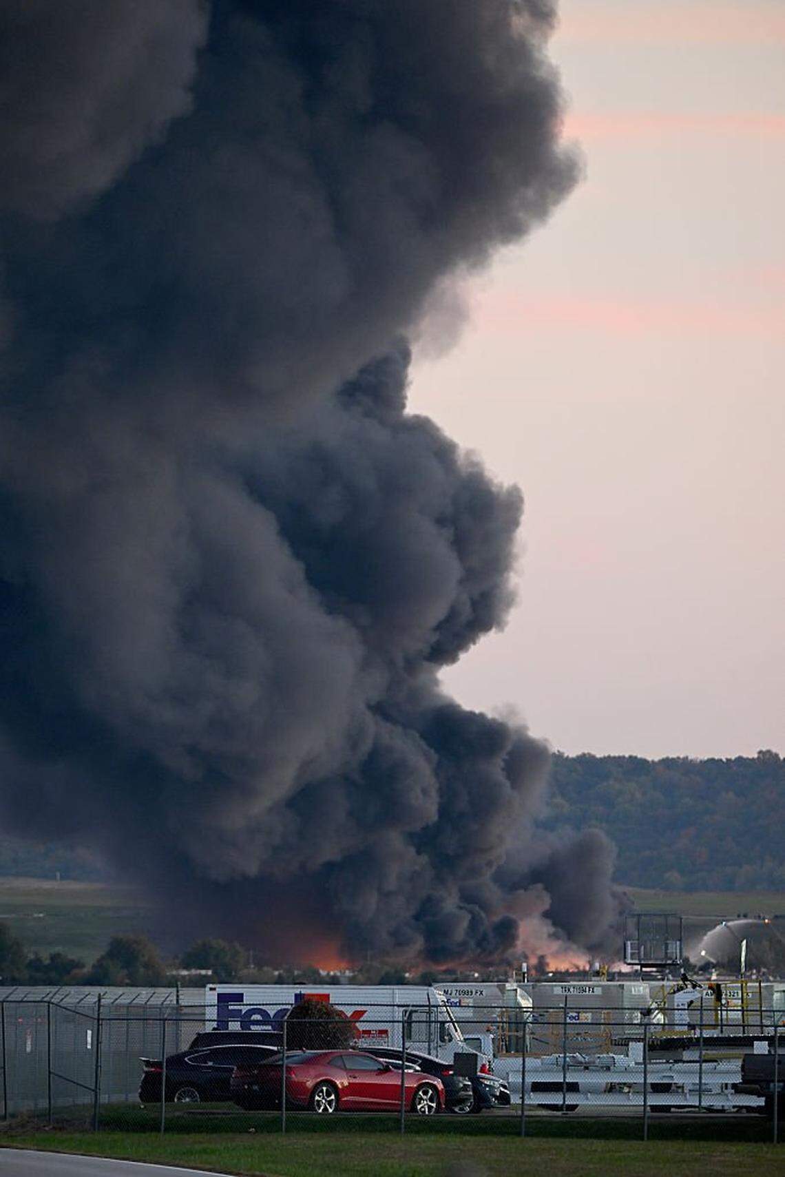 LOUISVILLE, KENTUCKY - NOVEMBER 04: Fire and smoke mark where a UPS cargo plane crashed near Louisville Muhammad Ali International Airport on November 04, 2025 in Louisville, Kentucky. The fully fueled plane crashed shortly after takeoff with a shelter-in-place order issued for within 5 miles of the airport. (Photo by Stephen Cohen/Getty Images)
