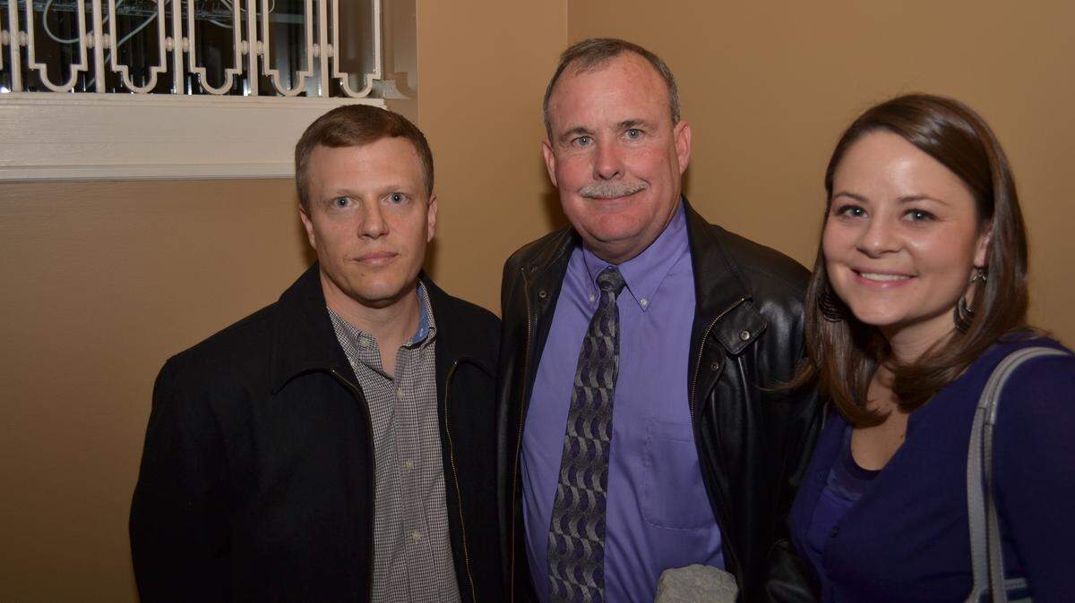 Three of Sarah Hart's family members accepted the Most Encouraging Kentuckians award from LeXenomics on Wednesday night. From left: Ryan Hart, Sarah Hart's husband; Wendell Roberts, Sarah's father; and her sister Elizabeth Roberts.      