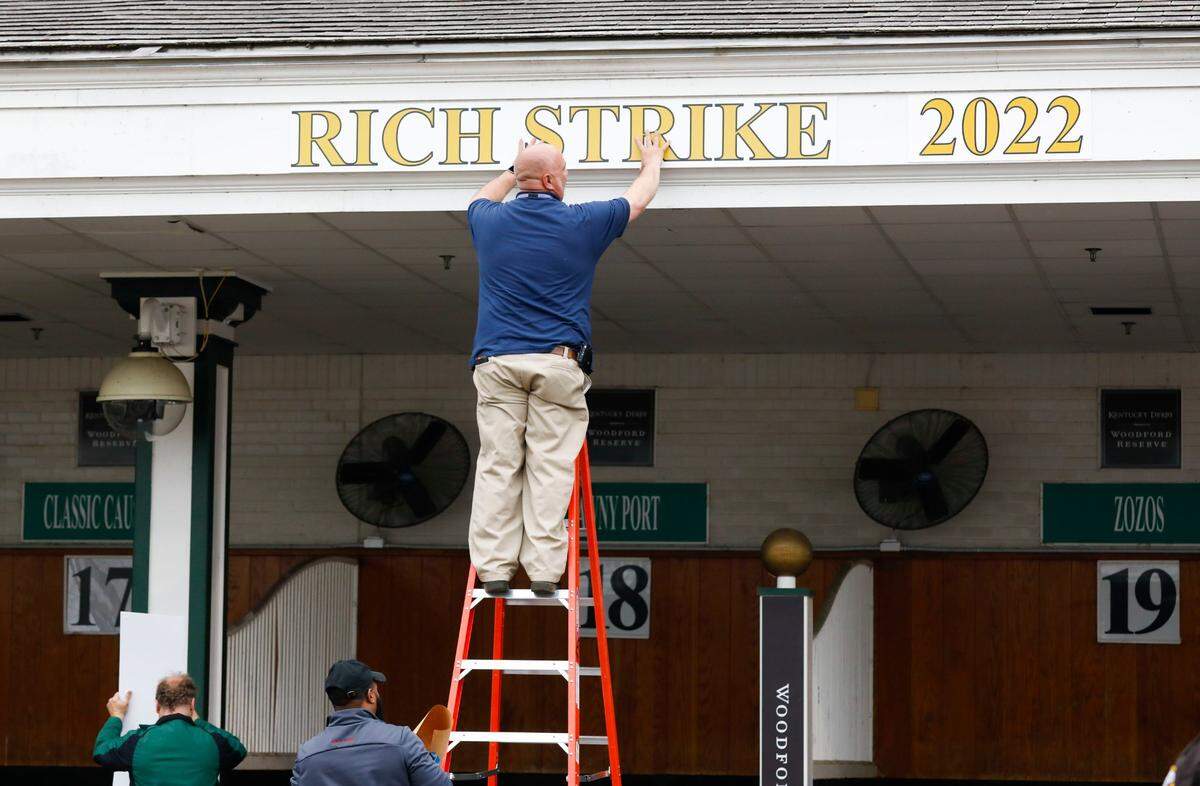 Rich Strike’s name is added to the paddock shortly after his win in the Kentucky Derby at Churchill Downs on Saturday.