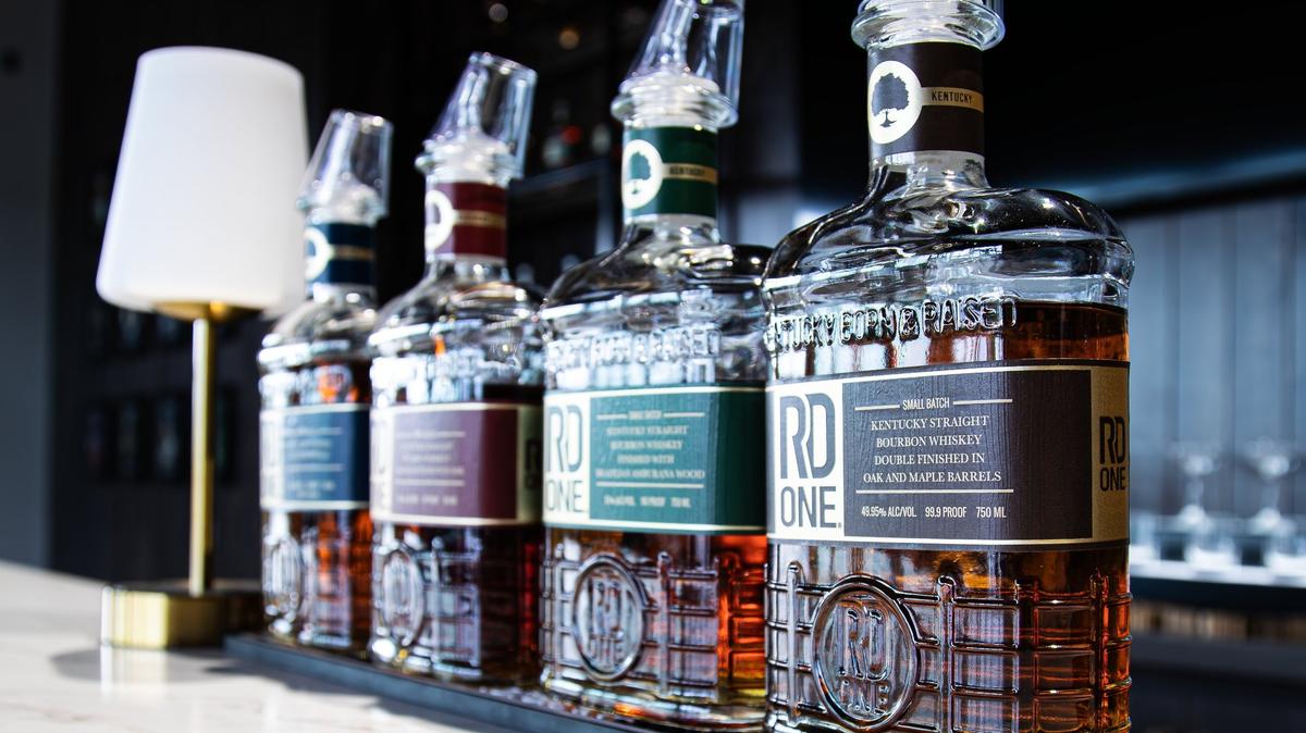 A set of small-batch distilled Kentucky bourbon sets on one of many RD1 Distillery at The Commons bars before the official May 14th grand opening on May 13, 2025, in Lexington, Ky.