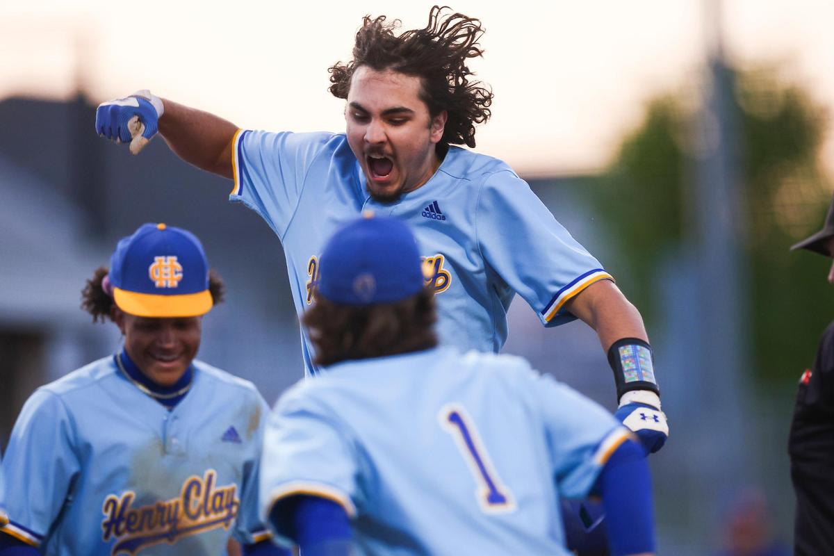 Henry Clay’s Kai Aoki, top, celebrates hitting a two run home run at Frederick Douglass during Wednesday night’s 3-1 Blue Devils win.