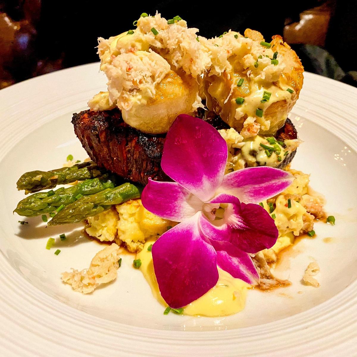 Oscar style medallions is one of the most popular dishes at Carson’s. The dish features two 4 oz. filet medallions served on Yukon Gold garlic mashed potatoes and asparagus, then topped with béarnaise and truffle buttered crab and lobster.