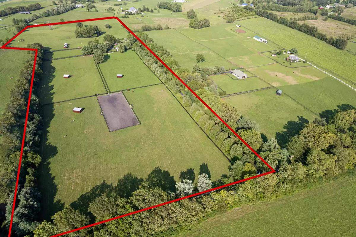 A drone shot of the land parcel and home the property sits on at 4351 Bethel Road. The property is 27 acres. 