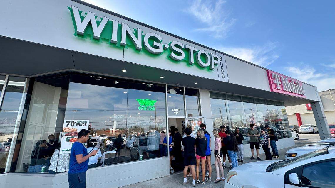 Customers line up outside the door at Lexington’s first Wingstop location on Richmond Road on opening day for the popular chicken chain restaurant, Wednesday, March 12, 2025 in Lexington, Ky.