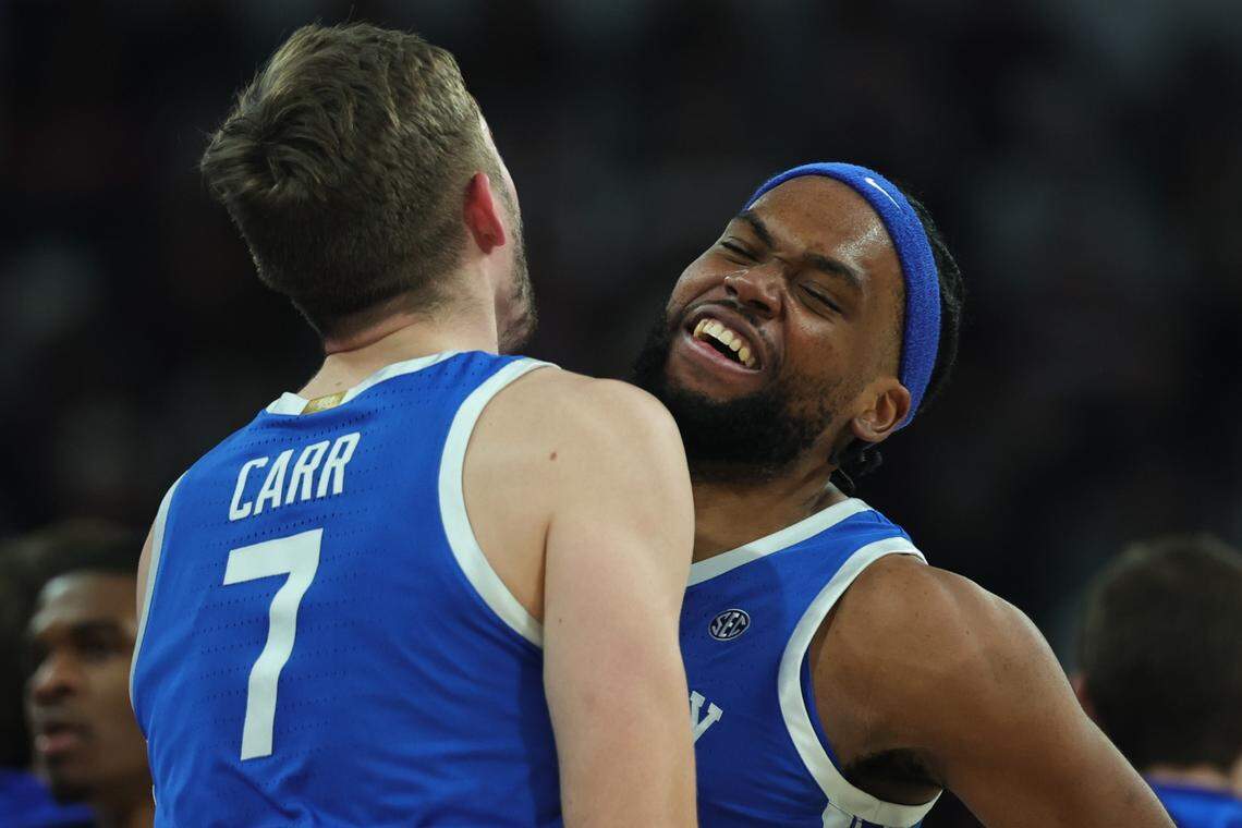 Kentucky’s Andrew Carr and Ansley Almonor celebrate during Saturday’s win at Mississippi State.