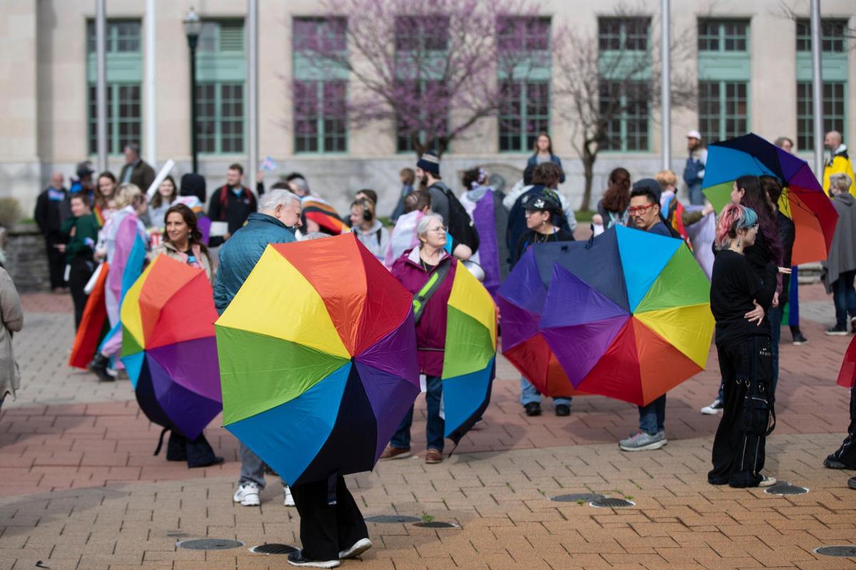 People gather for a rally organized by LGBTQ youth and adults in opposition to Senate Bill 150 and also to celebrate Trans Day of Visibility in Lexington, Ky., Friday, March 31, 2022.