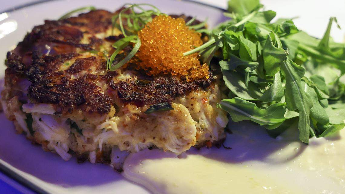 A jumbo lump crab cake with lemon aioli, arugula and tobiko ($38) from The V, the public restaurant at The Vine, a new downtown Lexington development, photographed Friday, Sept. 5, 2025.