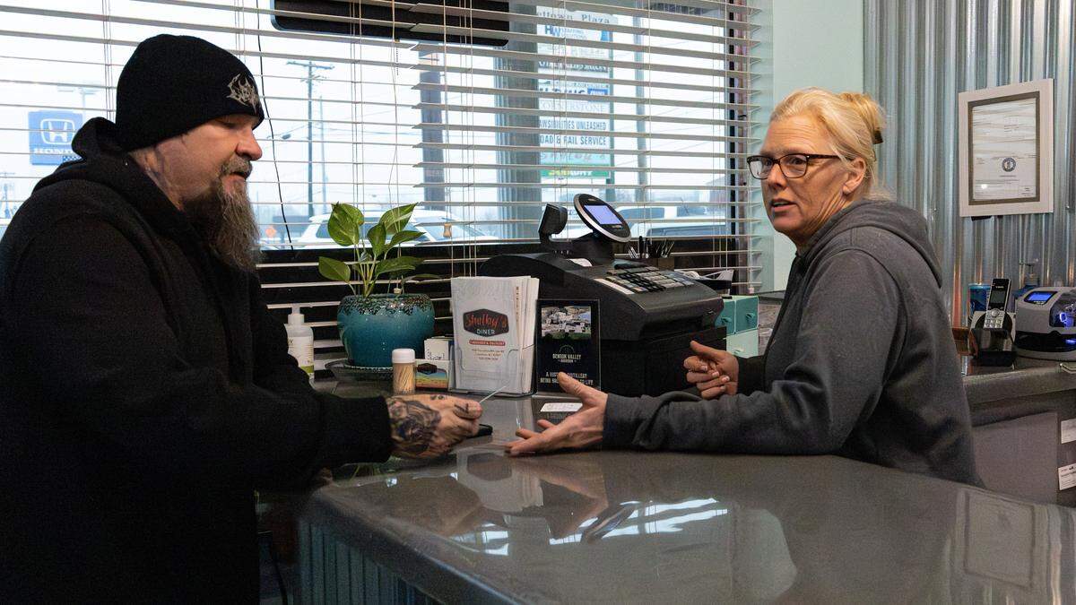 Shelby Keith, owner of Shelby's Diner, socializing with customers and having small talk on Nov. 19, 2025, in Frankfort, Ky. 