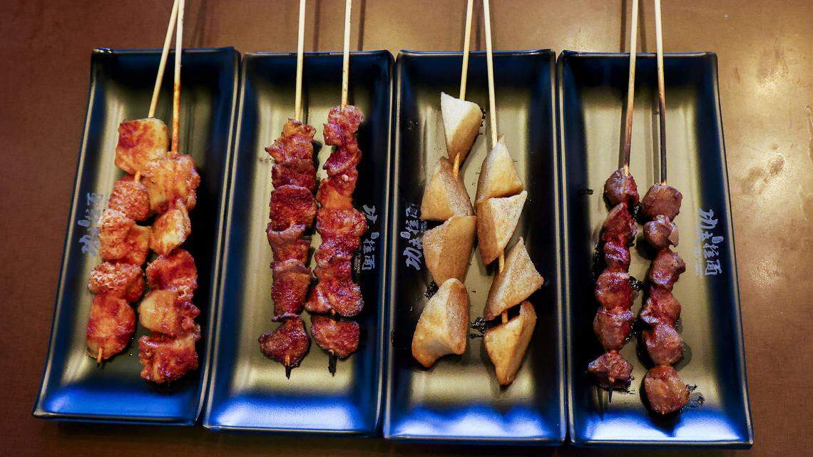 Four authentic Chinese food appetizer skewers ($3 each) photographed Wednesday, Aug. 13, 2025, at Kung Fu Noodle. From left, beef tripe, lamb skewers, fish tofu and chicken gizzard. 