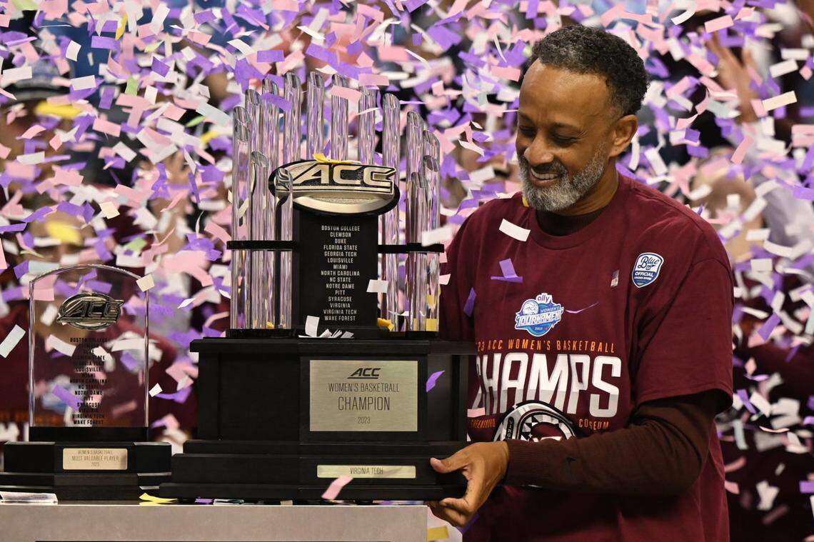 Kenny Brooks holds the championship trophy after his Virginia Tech team won the ACC Tournament championship by defeating Louisville in 2023. Virginia Tech announced Tuesday that Brooks had resigned as Hokies coach to become Kentucky women’s basketball coach.